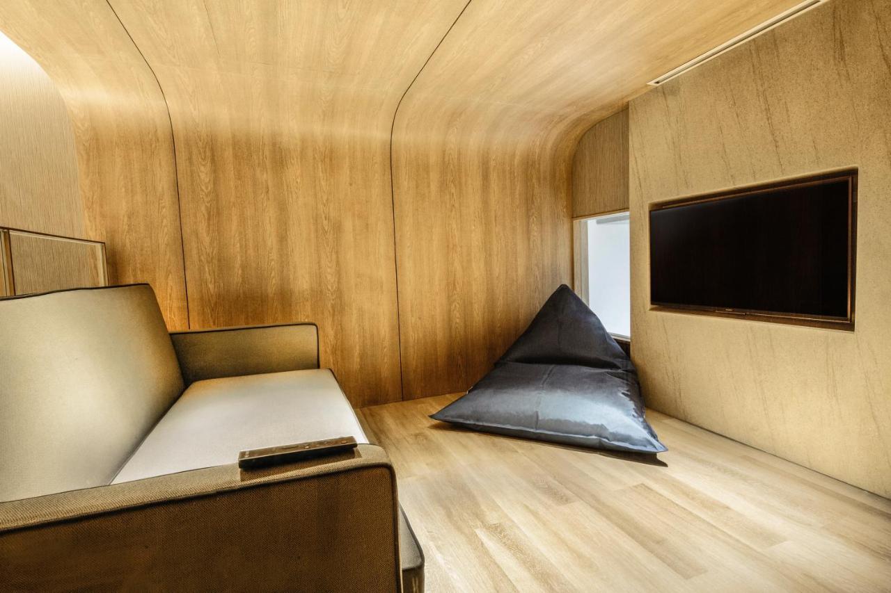 The Botanica Sanctuary Puncak Exterior foto Interior of a capsule hotel